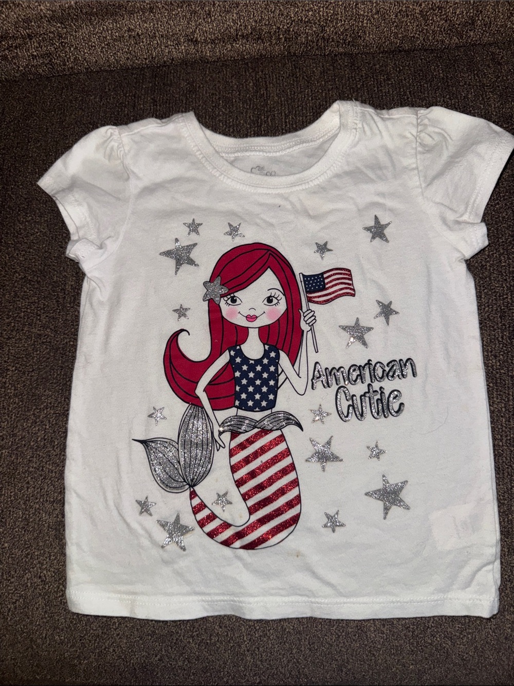 1989 Place White Tee with Red-Haired Mermaid and Flag Graphic